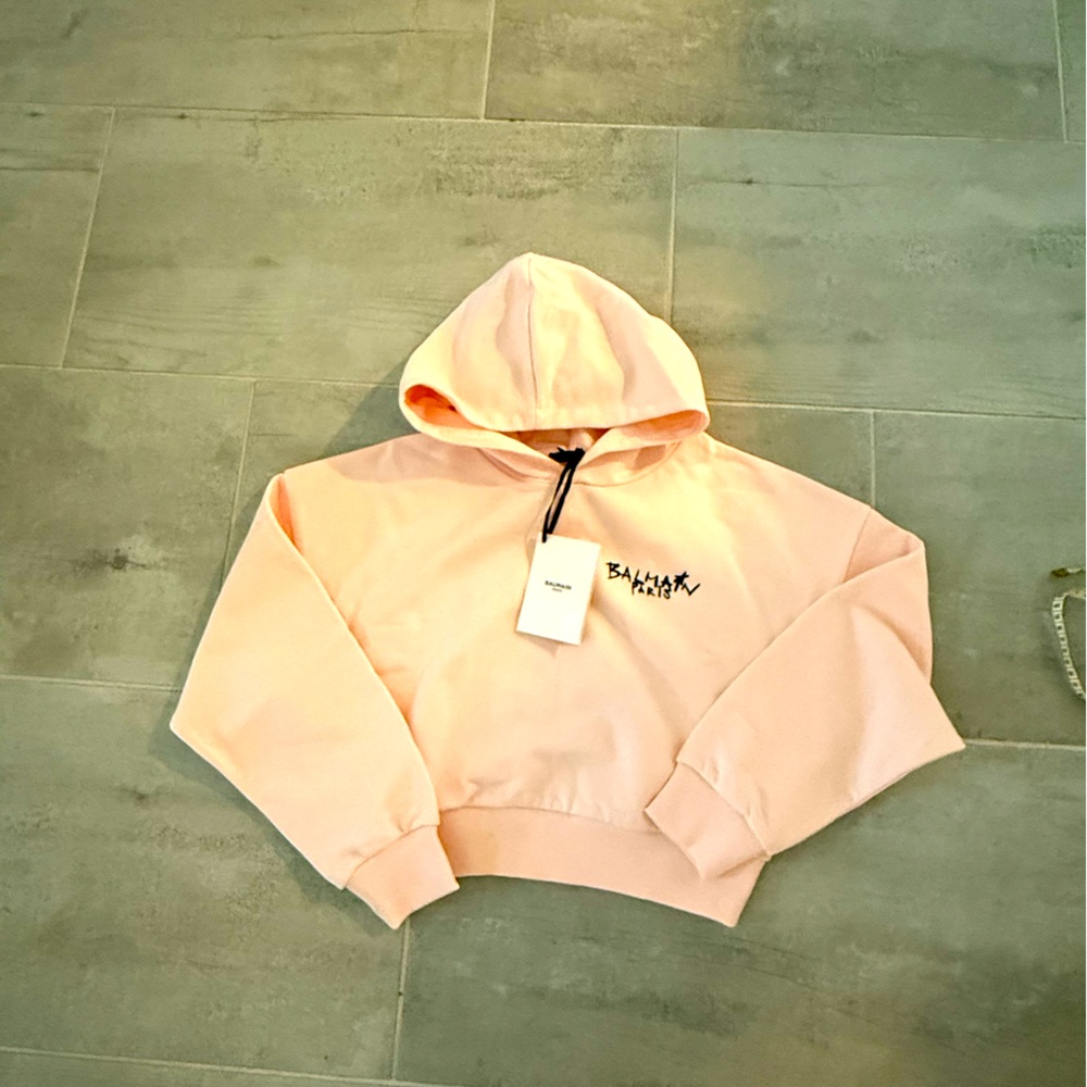 New authentic Balmain cropped hoodie, size small. Light peach- pink color.